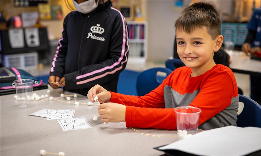 Students make constellations out of marshmallows and toothpicks